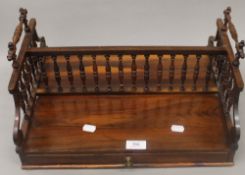 A 19th century rosewood book rack. 42.5 cm wide.