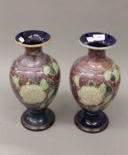A pair of Royal Doulton stoneware vases. 35 cm high.