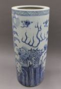 A blue and white porcelain stick stand. 61 cm high.