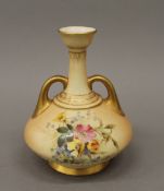 A Royal Worcester blush ivory florally decorated vase. 16 cm high.