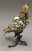 A cold painted bronze model of a parrot.