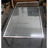 A mid/late 20th century glass topped tubular chrome coffee table.