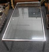 A mid/late 20th century glass topped tubular chrome coffee table.