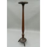 A Victorian mahogany torchere. 159.5 cm high.