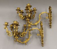 A pair of late 19th/early 20th century gilt bronze wall lights. 43 cm long.