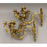 A pair of late 19th/early 20th century gilt bronze wall lights. 43 cm long.