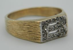 A 9 ct gold ring formed as the initial B. Ring Size U. 5.6 grammes total weight.