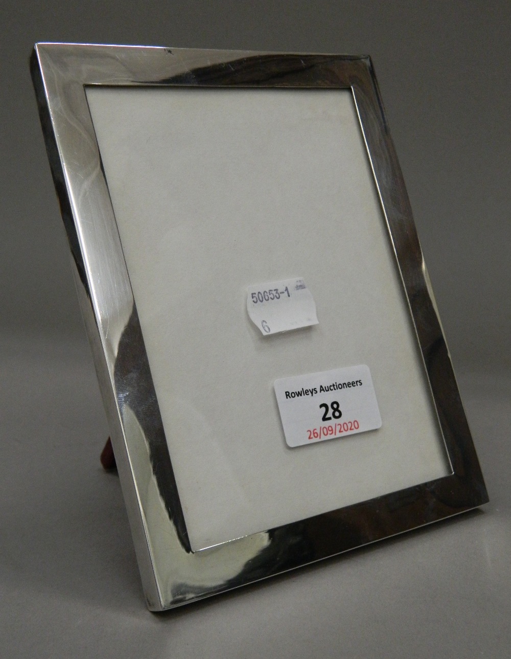 A silver photograph frame. 12.5 cm wide x 16.5 cm high.