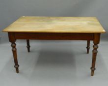 A Victorian pine farmhouse kitchen table. 148 cm long, 95.5 cm wide.