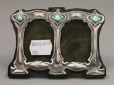 A sterling silver Art Nouveau style double photograph frame. 11 cm wide.