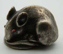 A small model of a rat, bearing Russian marks. 3 cm wide.