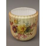 A Royal Worcester blush ivory ribbed flowerpot. 14 cm high.