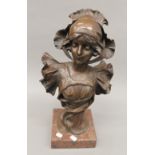 A patinated bronze bust of a young lady, signed H Jacob, mounted on a rouge marble plinth.