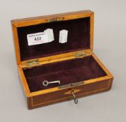 An Edwardian mahogany inlaid trinket box. 15 cm wide.