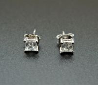 A pair of 14 K white gold stone set ear studs