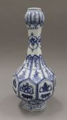 A Chinese blue and white gourd shaped vase. 38 cm high.