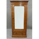 A Victorian mahogany single mirrored door wardrobe. 95 cm wide x 206 cm high.