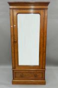 A Victorian mahogany single mirrored door wardrobe. 95 cm wide x 206 cm high.