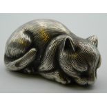 A silver model of a cat, bearing Russian marks. 7 cm long. 55.5 grammes.