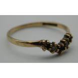 A 9 ct gold diamond and amethyst wishbone ring. Ring Size L. 0.9 grammes total weight.