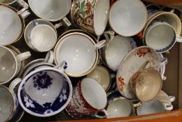 A collection of 18th/19th century porcelain cups, including Worcester, Derby, etc.