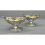 A pair of Scottish silver pedestal navette shaped salts, with gilt interiors, Edinburgh 1833,