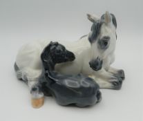 A Royal Copenhagen porcelain model of a horse and foal, numbered 4698. 18 cm wide.