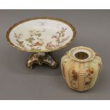A Royal Worcester florally decorated tazza and a Royal Worcester blush ivory vase. The former 24.