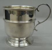 A boxed silver Christening mug. 6.5 cm high. 1.6 troy ounces.