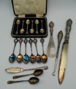 A cased set of silver spoons, etc.