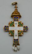 A silver gilt enamel decorated cross form pendant, set with seed pearls, bearing Russian marks. 6.