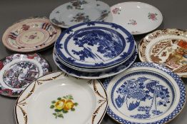 A quantity of 18th/19th century dishes and plates. The largest 25 cm diameter.