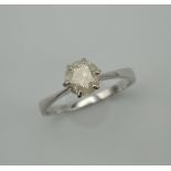 An 18 K white gold diamond solitaire ring. The stone approximately 1.25 carats. Ring Size V/W. 3.