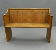 A Victorian pine church pew. 118 cm wide. The property of Germaine Greer.