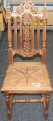 A Victorian carved oak side chair. 45 cm wide.