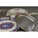 A small quantity of silver plate, together with two meat plates. The largest meat plate 46 cm long.