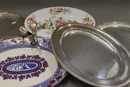 A small quantity of silver plate, together with two meat plates. The largest meat plate 46 cm long.