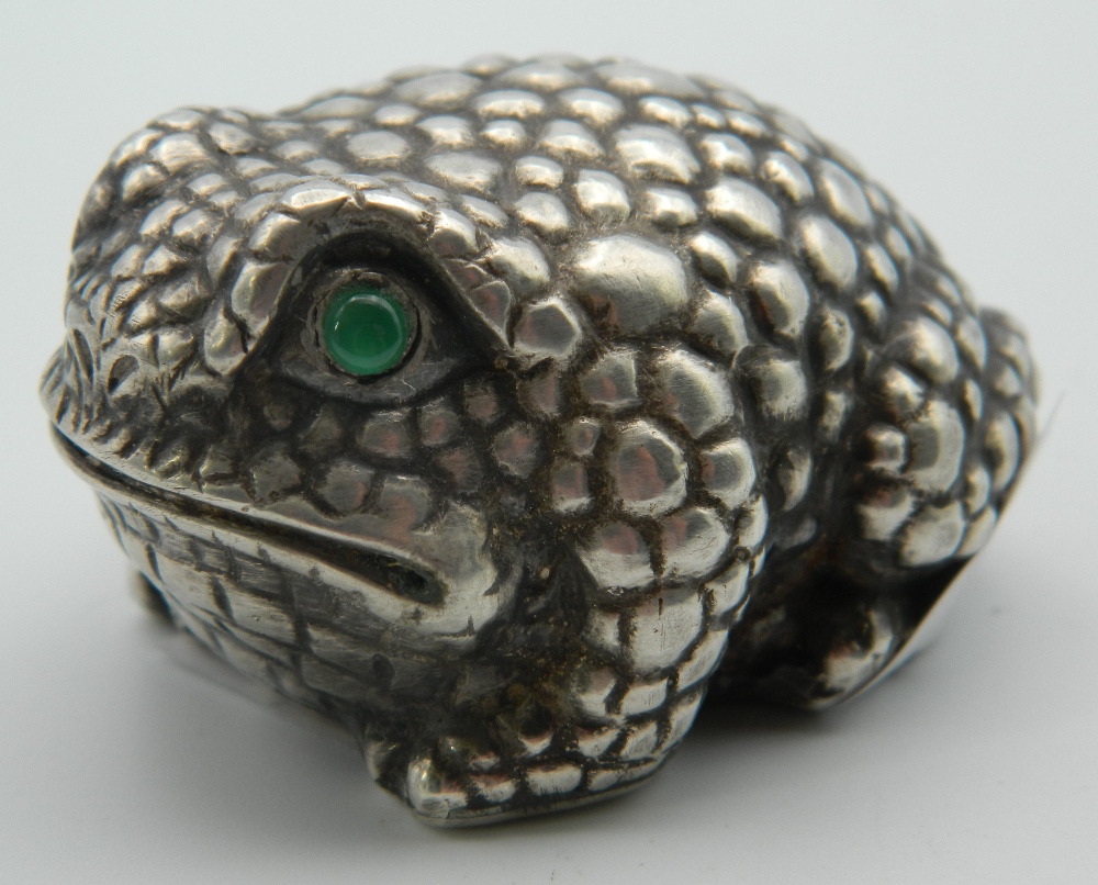 A silver model of a frog, bearing Russian marks. 5 cm long.