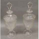 A pair of cut glass lidded vases. 56 cm high.