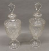 A pair of cut glass lidded vases. 56 cm high.