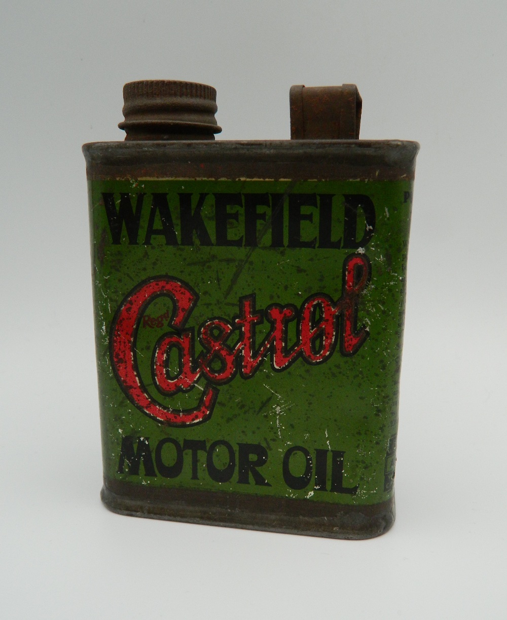 An early Wakefield Castrol Motor Oil half pint oil can. 12 cm high.