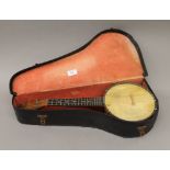 A Dulcetta banjo, cased. 55 cm long.