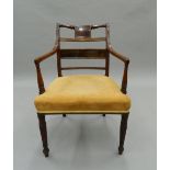 A 19th century mahogany open armchair. 55 cm wide.