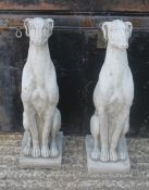 A pair of garden ornaments formed as greyhounds. 54 cm high.