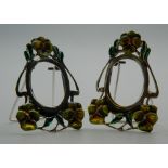 A pair of silver Art Nouveau style miniature photograph frames. Each 4.5 cm high.