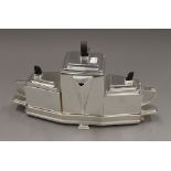 A silver plated Art Deco style tea set. 22 cm high.