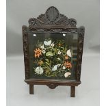 A Victorian carved oak tapestry inset screen. 66 cm wide.