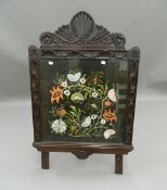 A Victorian carved oak tapestry inset screen. 66 cm wide.