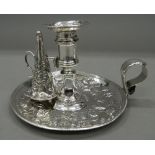 A mid-18th century silver chamberstick and snuffer. 9.5 cm high. 12.