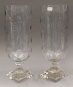 A pair of cut glass storm lamps. 39.5 cm high.